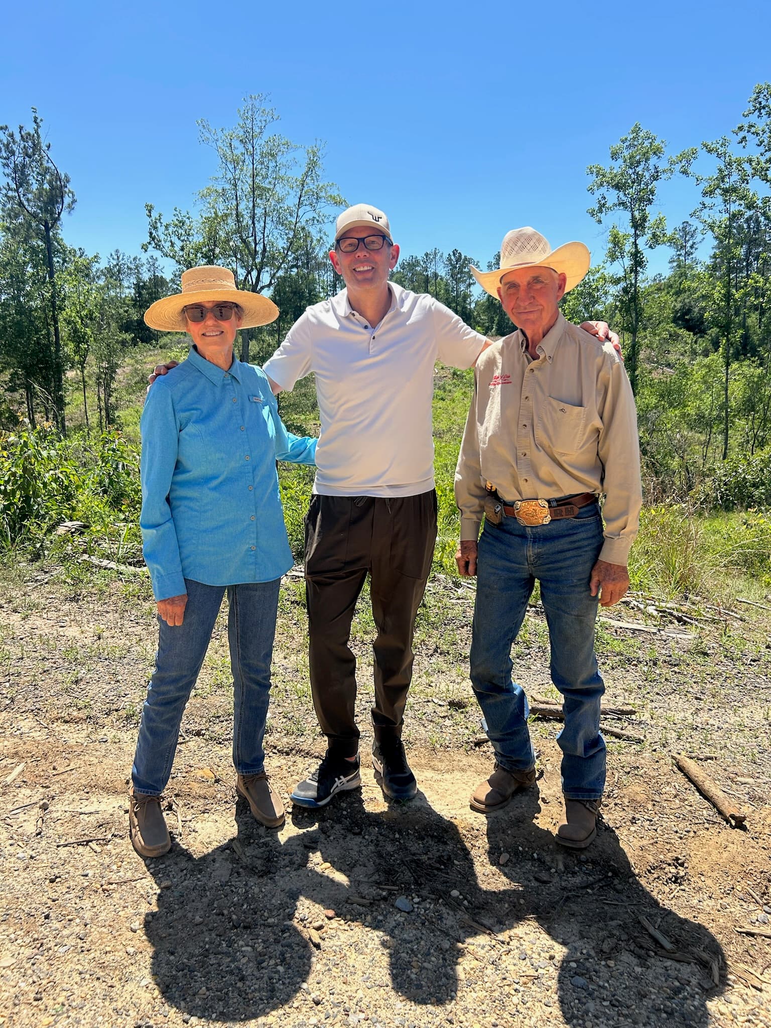 Three of the River Woods Ranch team on a dirt road